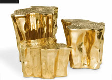 Load image into Gallery viewer, Gold tree stump tables with Leon Home logo in the corner