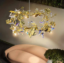 Load image into Gallery viewer, Sculptural Butterfly Bloom Chandelier Design Whimsical Fusion of Crystal Wings and Golden Leaves Illuminating Elegance and Natural Charm in a Modern Dining Space Delicate Light Dances
