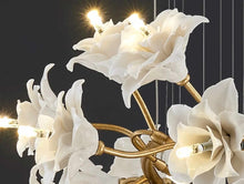 Загрузить изображение в средство просмотра галереи, Floral Halo Radiance A Sculptural Chandelier with Ceramic Blossoms and Golden Leaves Soft Light Dances Through Delicate Petals Casting a Dreamy Glow