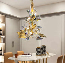 Load image into Gallery viewer, Sculptural Butterfly Bloom Chandelier Design Whimsical Fusion of Crystal Wings and Golden Leaves Illuminating Elegance and Natural Charm in a Modern Dining Space Delicate Light Dances