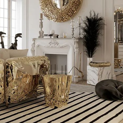 Luxurious living room with gold furniture, striped rug, and decorative elements.