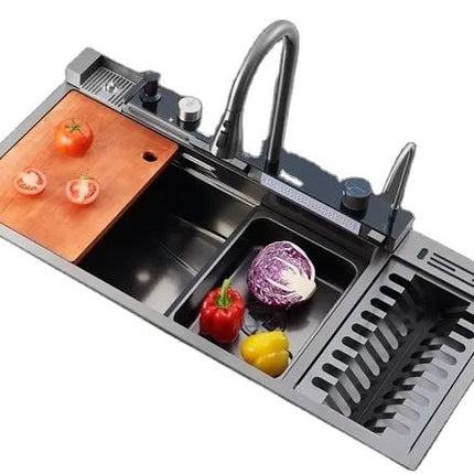 Stainless steel kitchen sink with vegetables on a white background