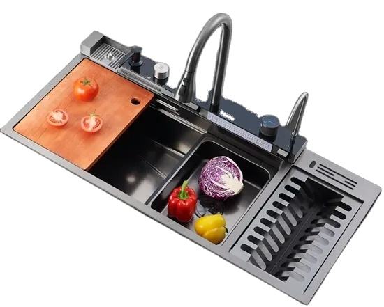 Stainless steel kitchen sink with vegetables on a white background