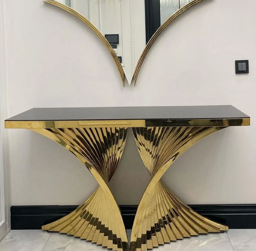 Wooden console table with decorative items in a modern interior stainless steel electroplated console table setting