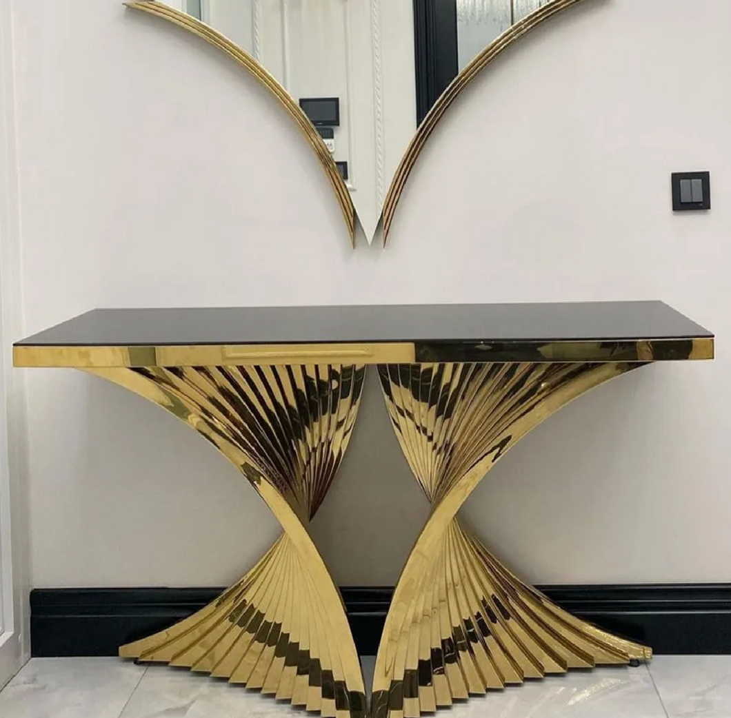 Wooden console table with decorative items in a modern interior stainless steel electroplated console table setting