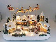 Charger l&#39;image dans la galerie, Christmas Village Santa and Reindeer Sounds and Lights With Charger Polyresin
