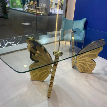 Table papillon moderne en acier inoxydable doré pour la location d'événements de luxe 