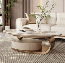 Load image into Gallery viewer, Modern living room with a round coffee table and white sofa.
