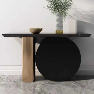 Modern console table with black and gold design against a neutral wall.