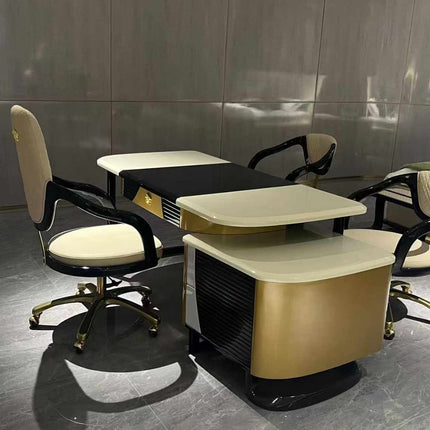 An office setting with a modern Matte Gold and Black Versace Medusa desk and chair, accompanied by spacious drawers.