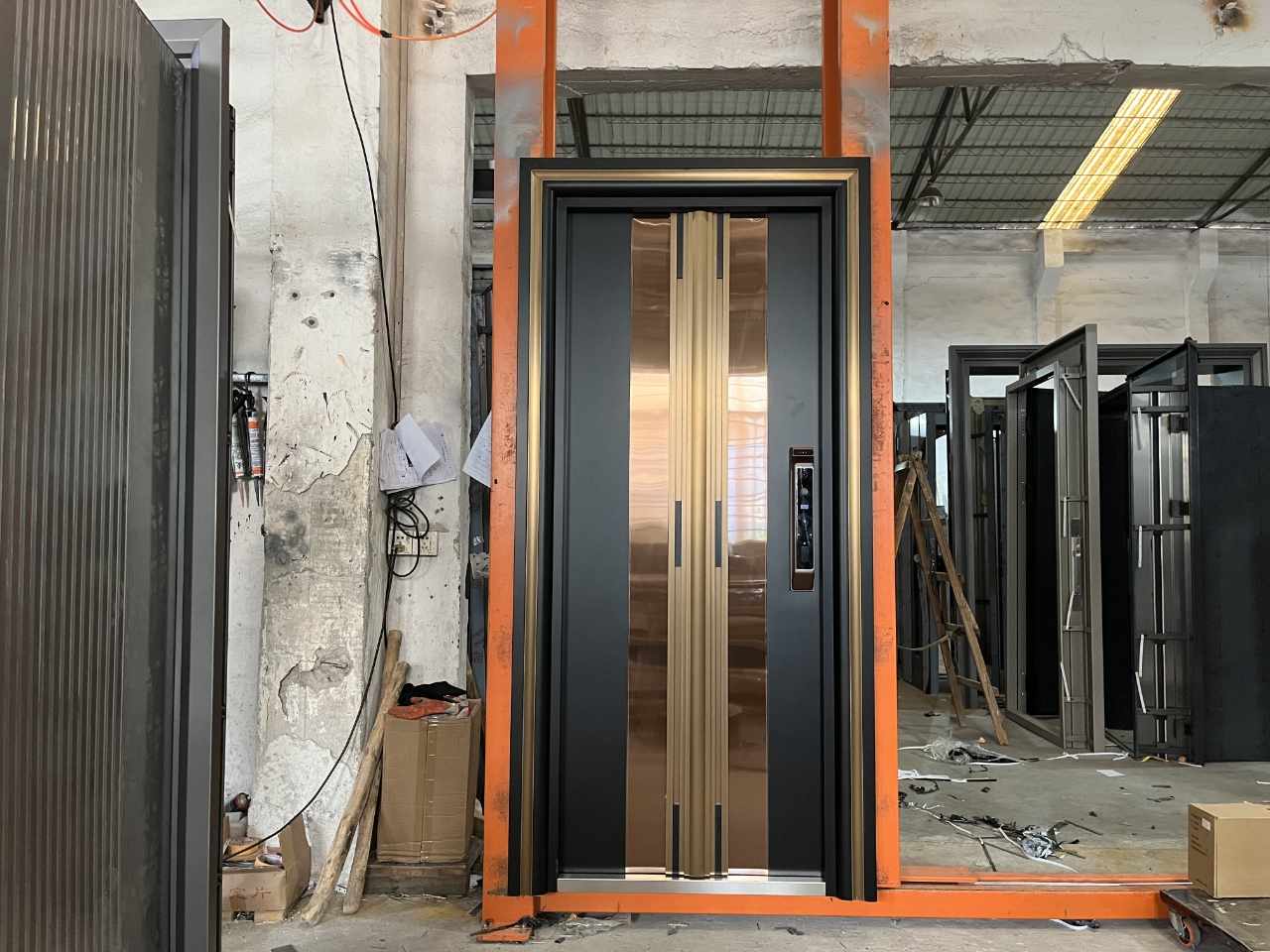Modern Fireproof and Soundproof and Heavy-Duty Security Door with Dual-Layered Metal Construction, Gold and Black Finish, Reinforced Frame, and High-Quality Stainless Steel Handles for Durability and Style