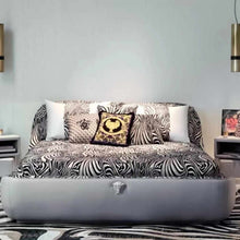 Load image into Gallery viewer, Modern Luxury Bedroom with Zebra-Print Upholstered Bed, High-Gloss Black and Gold Accented Chairs, Velvet and Silk Bedding, Custom Abstract Rug, and Elegant Pendant Lighting
