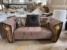 Lade das Bild in den Galerie-Viewer, Modern Fusion of Plush Mauve Velvet, Zebra-Print Accents, and Art Deco-Inspired Wood Paneling with Lion Head Hardware
