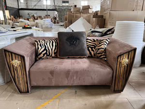 Modern Fusion of Plush Mauve Velvet, Zebra-Print Accents, and Art Deco-Inspired Wood Paneling with Lion Head Hardware