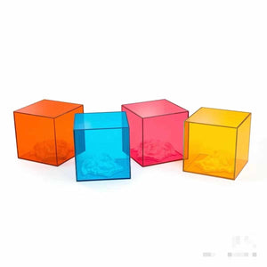 Acrylic Cubes in Vibrant Hues of Orange, Blue, Red, and Yellow, Showcasing Light Refraction and Shadow Play