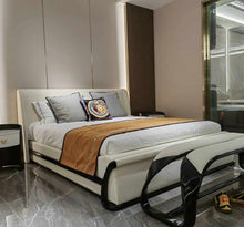 Lade das Bild in den Galerie-Viewer, Elegant Contemporary Bedroom with a Luxurious Leather Upholstered Bed, High-Gloss Black Accents, Velvet and Silk Bedding, Marble Flooring, and a Modern Glass-Enclosed Space
