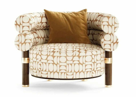 Sculptural Armchair with Geometric Patterned Upholstery, Cylindrical Cushions, and Contrasting Dark Legs with Brass Accents