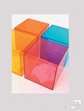 Cargar imagen en el visor de la galería, Acrylic Cubes in Vibrant Hues of Orange, Blue, Red, and Yellow, Showcasing Light Refraction and Shadow Play
