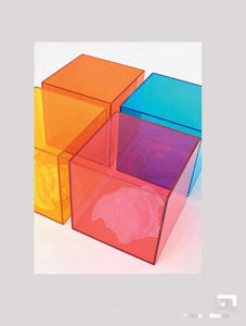 Acrylic Cubes in Vibrant Hues of Orange, Blue, Red, and Yellow, Showcasing Light Refraction and Shadow Play