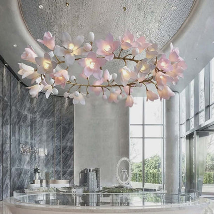 Floral chandelier in a modern interior setting with large windows and marble walls.