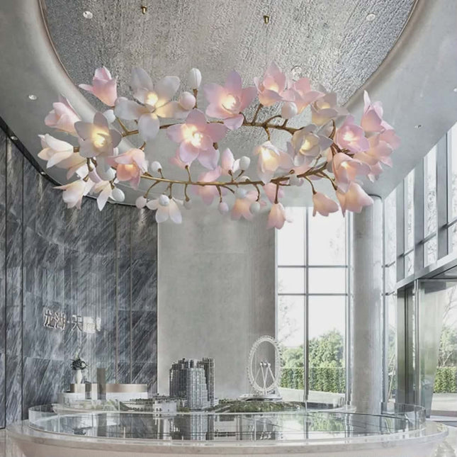 Floral chandelier in a modern interior setting with large windows and marble walls.