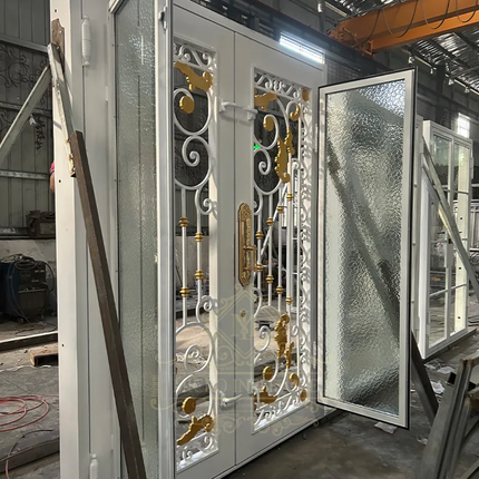 Decorative metal door with glass panels in a workshop setting
