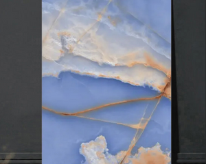Marble-like panel with blue and gold patterns on a dark background