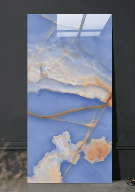 Marble-like panel with blue and gold patterns on a dark background