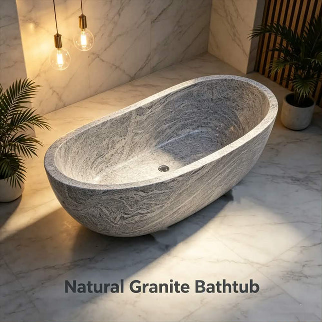 A freestanding oval natural granite bathtub with a textured gray and white stone pattern, set in a modern bathroom with marble walls and floor, warm hanging bulbs, and potted plants. Text overlay at the bottom reads 'Natural Granite Bathtub'.