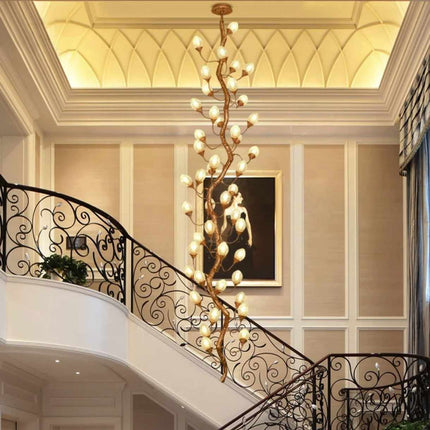 Sculptural Staircase Chandelier with Twisting Branches and Soft Glow Ascending Light Illuminating Elegance