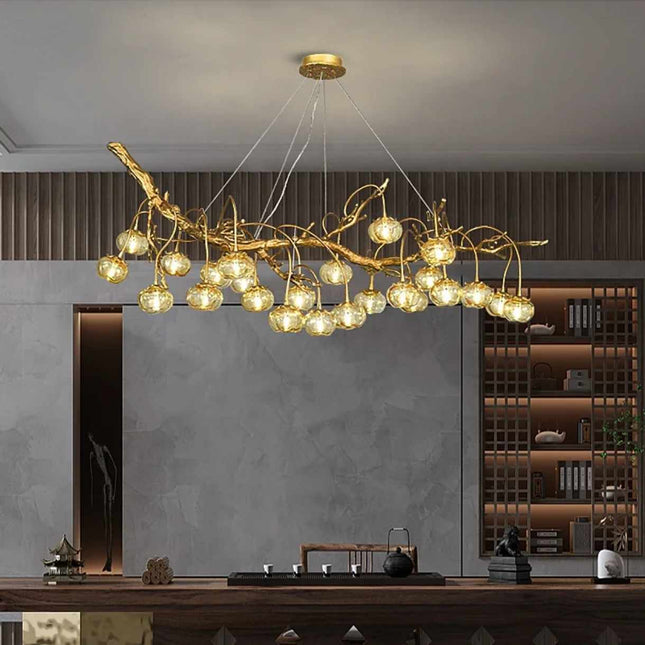 Golden Branch and Warm Light Cascades Through Sculptural Branches  Luminescence An Organic Chandelier with Amber Glass Orbs