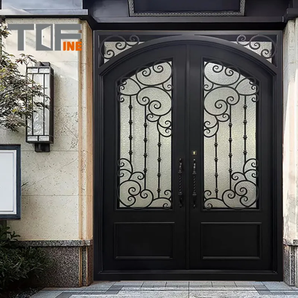 Decorative black door with intricate designs on a building facade, featuring the brand 'Tufine'.