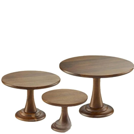 Three round wooden pedestal tables in different sizes, shown on a plain white background.