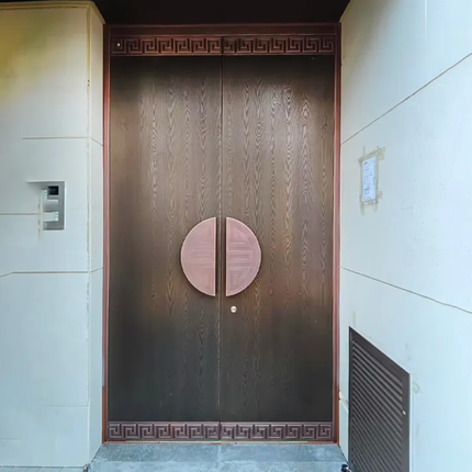 Wooden door with decorative elements on a building facade