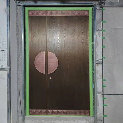 Wooden door with decorative elements in a construction setting
