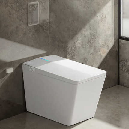 Modern white toilet in a bathroom with gray tiled walls
