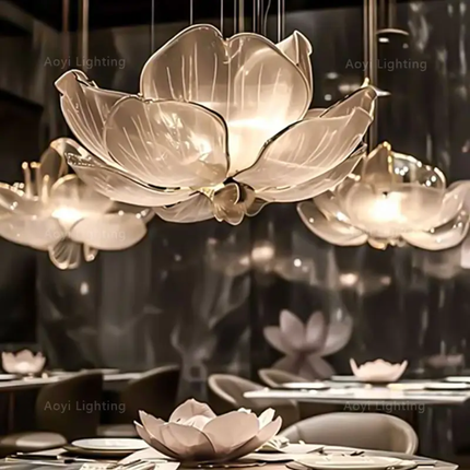 Lotus-shaped chandelier in a dining setting with Aoyi Lighting branding.