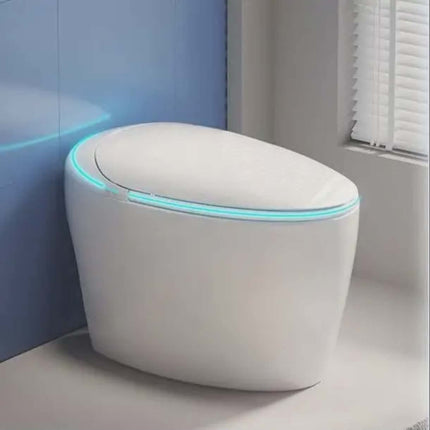 Modern white toilet with a blue light in a bathroom setting