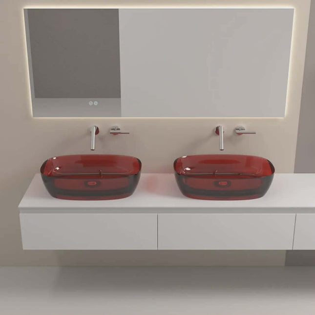 Bathroom vanity with two red glass sinks and a mirror.