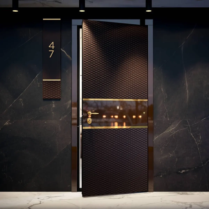Luxury door with textured design and gold accents on a dark marble wall.