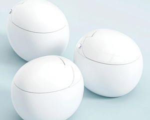 Three white spherical objects on a light blue background
