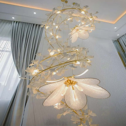 Decorative chandelier with floral design in a room with curtains and window.