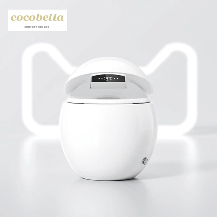 White cat-shaped humidifier with digital display on a light gray background, featuring the brand 'cocobella'.