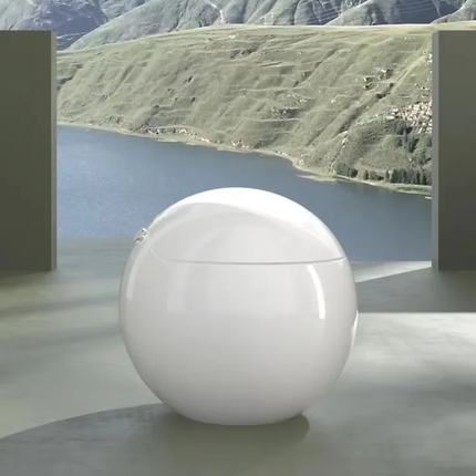 White spherical object on a reflective surface with a scenic background of mountains and water.