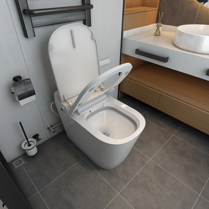 Modern bathroom with a white toilet, sink, and towel rack.