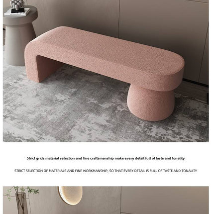 Pink textured bench in a modern interior setting with neutral tones.