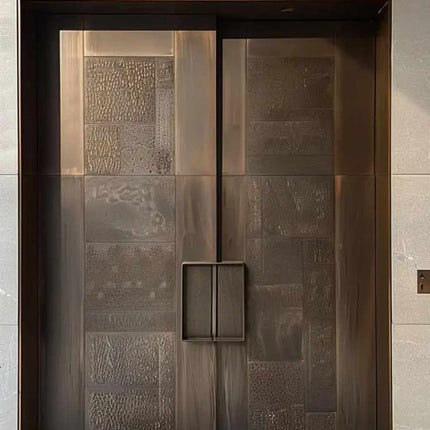 Custom solid metal double entry door with matte bronze finish and textured panel design