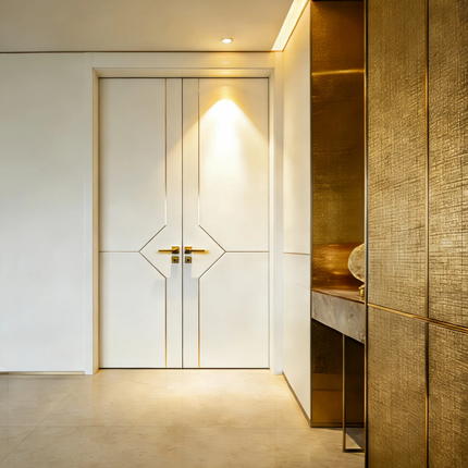 Modern interior with a white door and gold accents