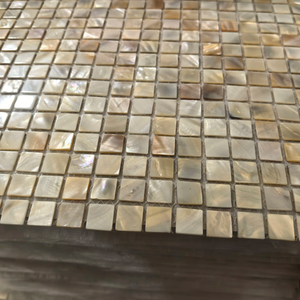 Mosaic tile pattern on a surface with various shades of brown and gray.