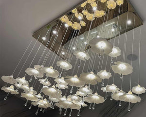 Ceiling-mounted chandelier with floral design on a gray ceiling